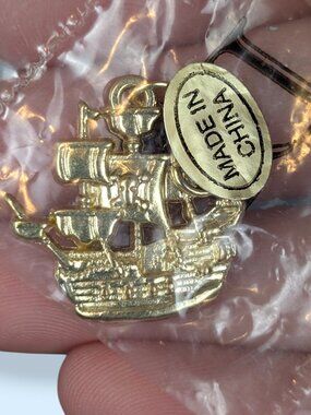 NWT Gold Tone Diamond International Ship Charm